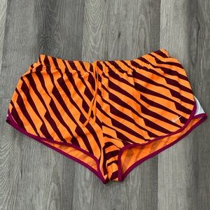 Nike Dri - Fit women’s running shorts lined size Large Orange Maroon stripes